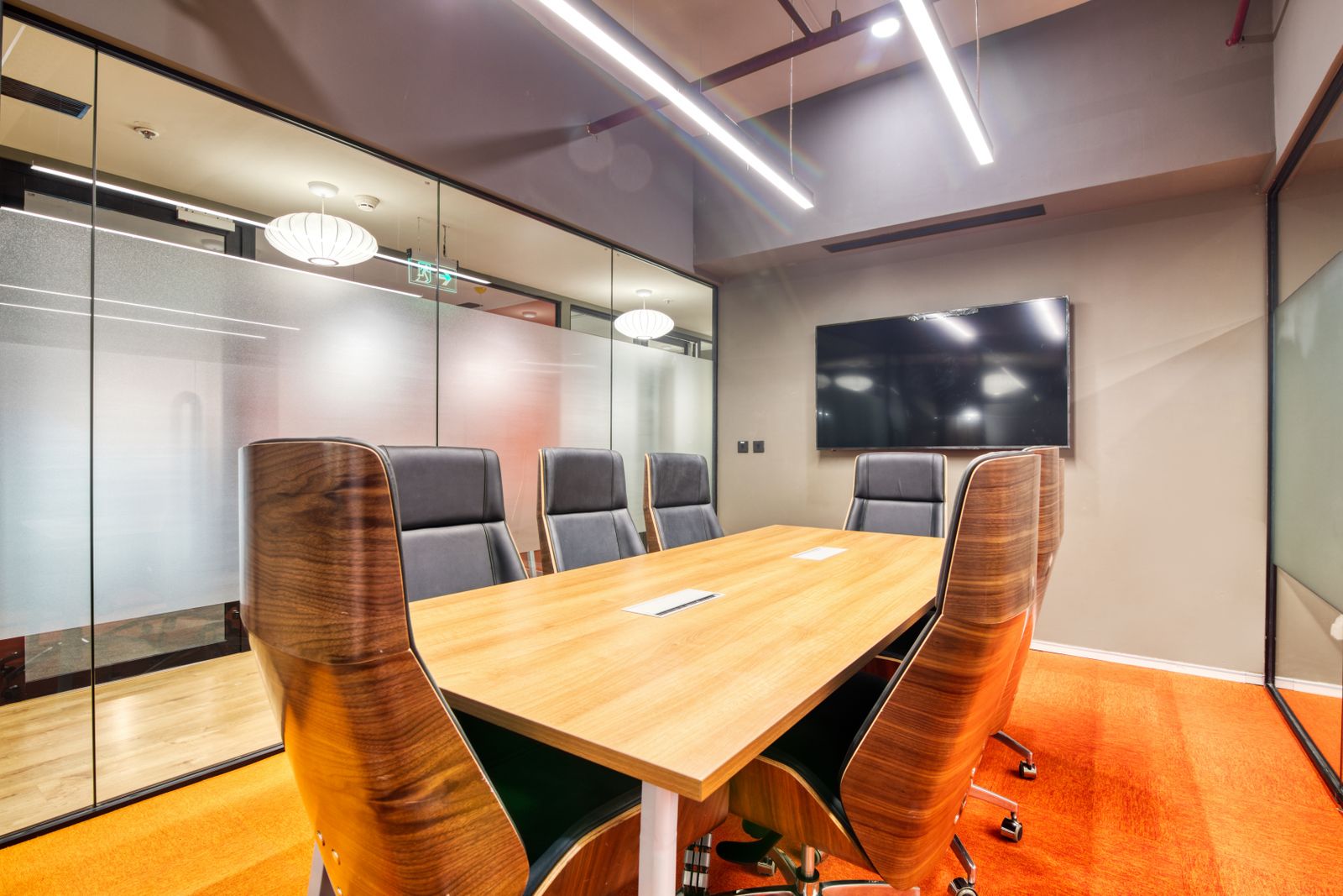 Firm conference room with a long table and chairs